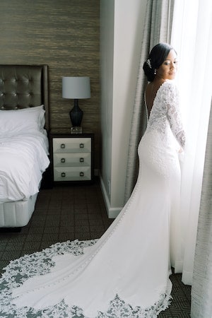 bride at window in her Ritz-Carlton Philadelphia hotel room