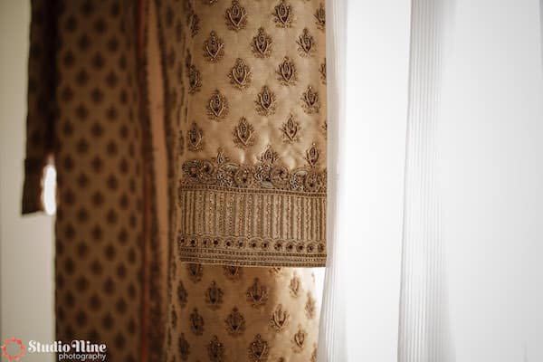 beautiful detailing on a South Asian groom's jacket