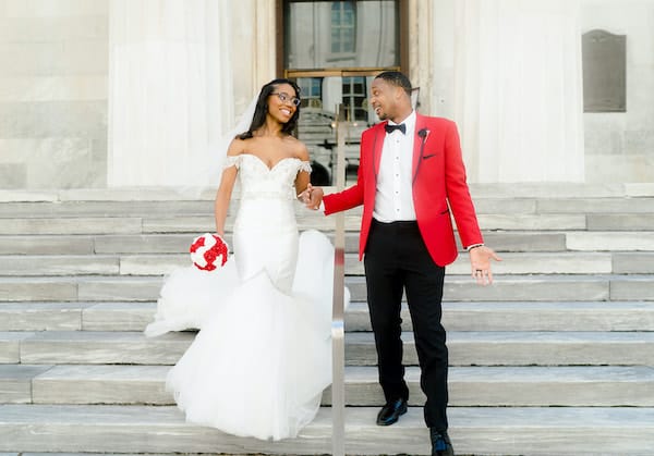 Bride and groom posing for photos in Old City Philadelphia after their intimate wedding ceremony