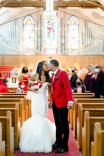 bride and groom kissing after their intimate socially distant wedding at St Matthew AME in Philadelphia