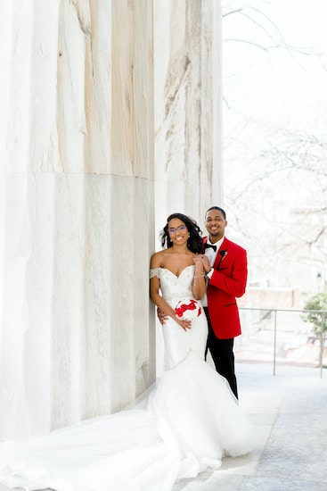 bride and groom on the steps of the Merchant Exchange in historic Old City Philadelphia