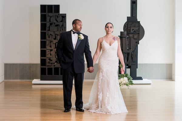 Black bride and groom in the Hamilton Gallery at the Pennsylvania Academy of the fine arts in Philadelphia