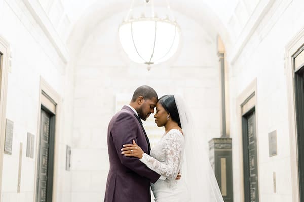 bride and groom posing for wedding photos at the Ritz Carlton Philadelphia