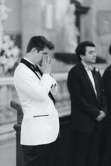 groom overwhelmed by emotion as his bride walks down the aisle