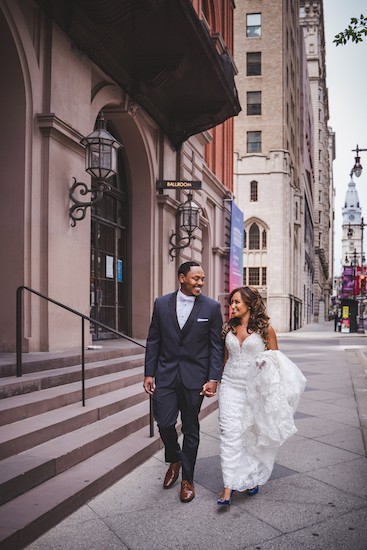 bride and groom in front of the Academy of Music in Philadelphia