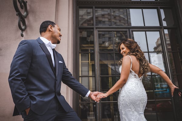 bride and groom in front of the Academy of Music in Philadelphia