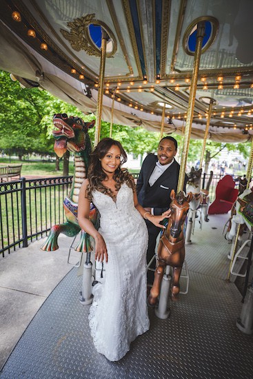 brid mand groom riding the Park Liberty Carousel in Franklin Square