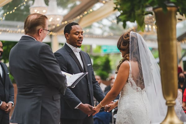 bride and groom exchanging wedding vows at their Cescaphe's Franklin's View wedding in Philly