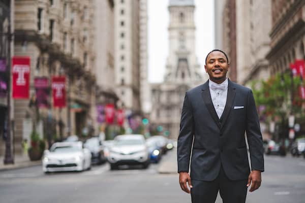 Groom standing on the island in south broad street waiting for his first look