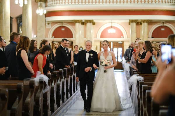 bride and her father walking down the aisle at St Rita's in Philadelphia