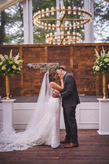 bride and groom kissing at the end of their wedding ceremony at Cescaphe's Franklin's View wedding venue in Old City Philadelphia