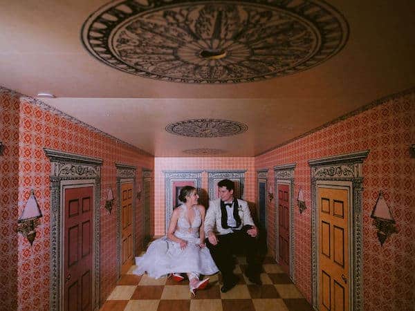 bride and groom in the Wonderland exhibit during their Please Touch Museum wedding