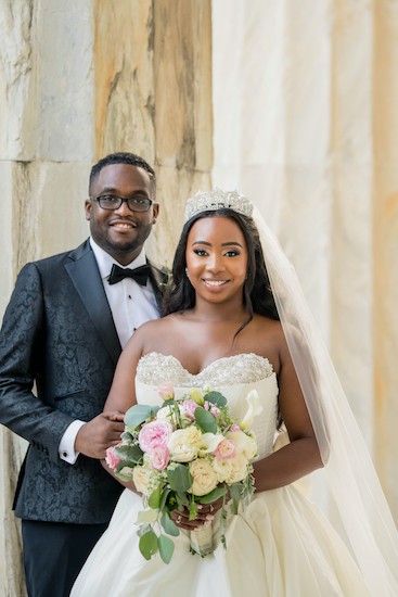 Smiling bride and groom very much in love