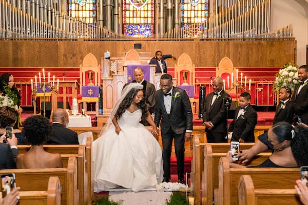 bride and groom jumping the broom a timeless celebration of love