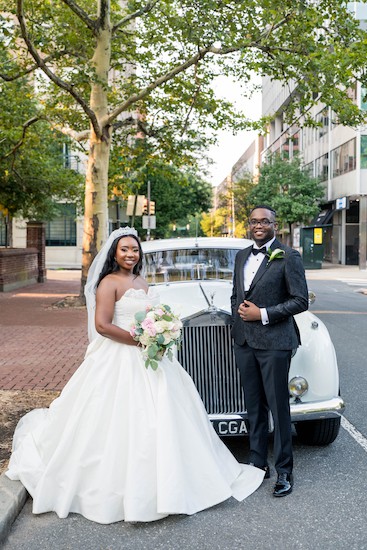 bride and groom in front of a classic white rolls Royce in Old City Philadelphia 