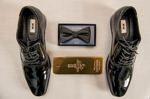 flatly photo of a grooms classic wedding accessories