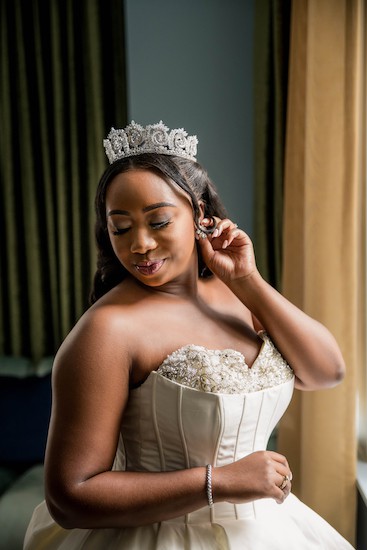 beautiful bride in a embroidered bustier wearing a timeless rhinestone crown