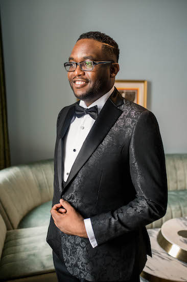 groom wearing a classic tuxedo with a beautifully patterned jacket