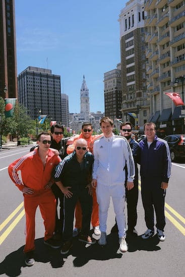 Groom and groomsmen on the Ben Franklin Parkway in front of Philadelphia's City Hall