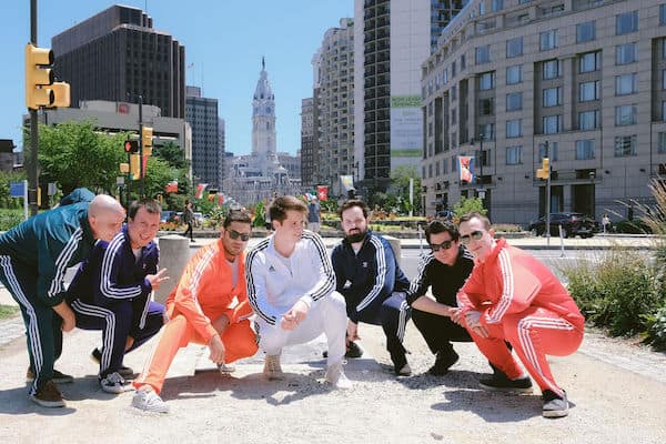 Groom and groomsmen on the Ben Franklin Parkway in front of Philadelphia's City Hall