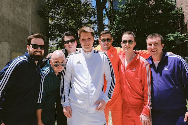 Groom and groomsmen in brightly colored tracksuits