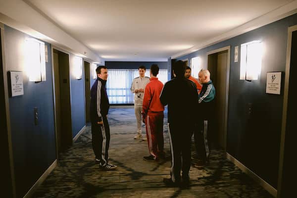 Philadelphia groom and his groomsmen wearing brightly colored tracksuits