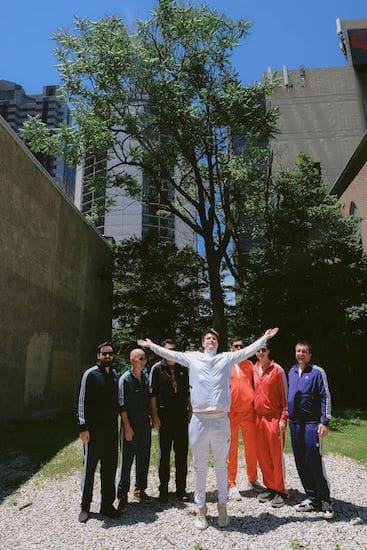 groom with groomsmen wandering philadelphia in tracksuits