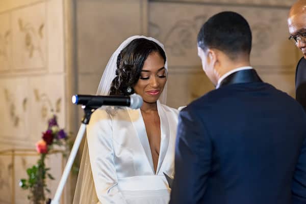 Black bride and groom exchanging wedding vows at their wedding at PAFA