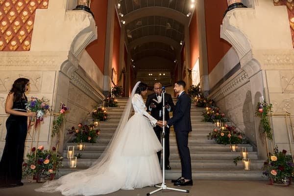 Black bride and groom exchanging wedding vows at their Philadelphia wedding at PAFA