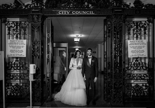 Philadelphia bride and groom in front of Philadelphia City Council where they met