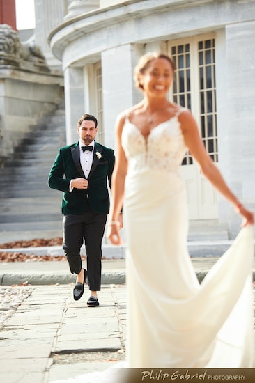 Philadelphia groom walking up behind his bride for their first look at the Merchants Exchange in Old City