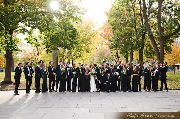 Bride adn groom with thier wedding party in Washington Sqaure Park in Old City Philadelphia