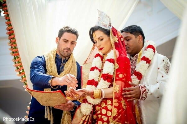 Bride, groom and bride's brother during thier Hindu wedding ceremony