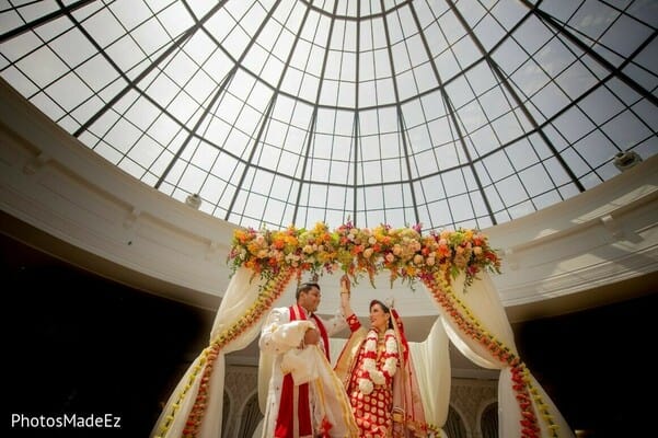 Bride and groom under a mandap suring their Hindu wedding ceremony at The Merion in South Jersey