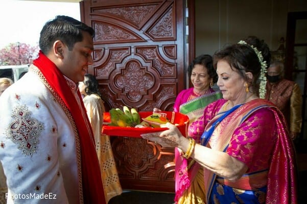 Indian groom being welcomed by family members at his south jersey wedding