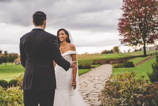 smiling bride during their first look