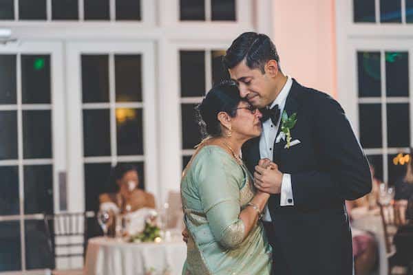 Indian groom dancing with his mother