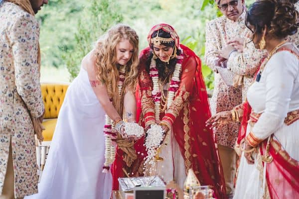 two brides during a traditional South Asian wedding