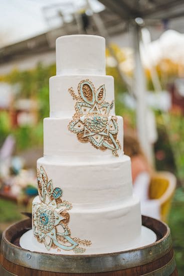 white wedding cake with a south Asian mandala motif