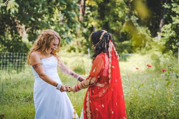 Two brides sharing their first look