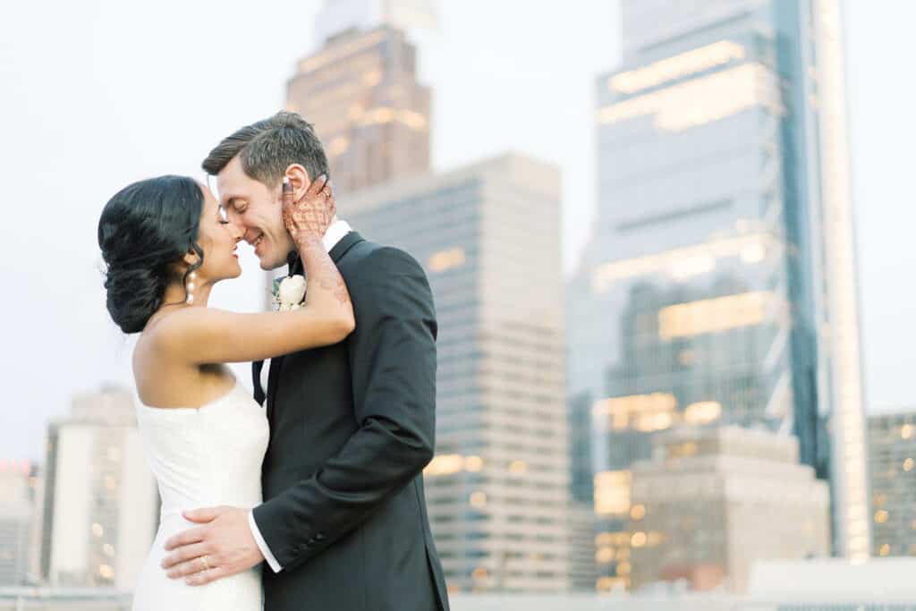 Bride and groom in front of Philadelphia skyline