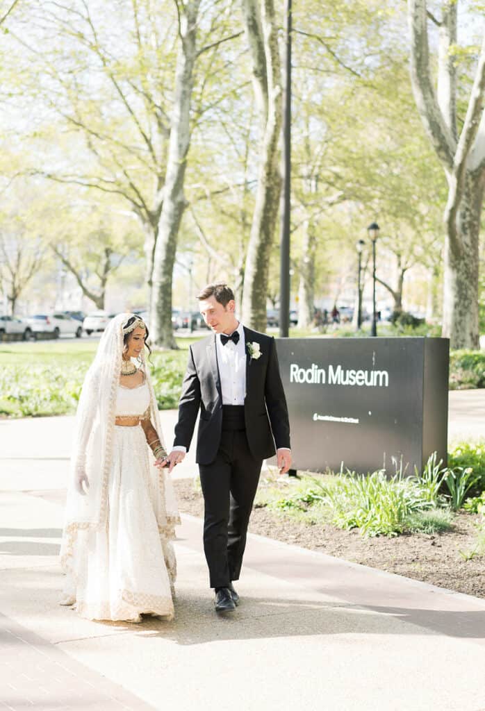 Bride and groom in front of Rodin Museum sign