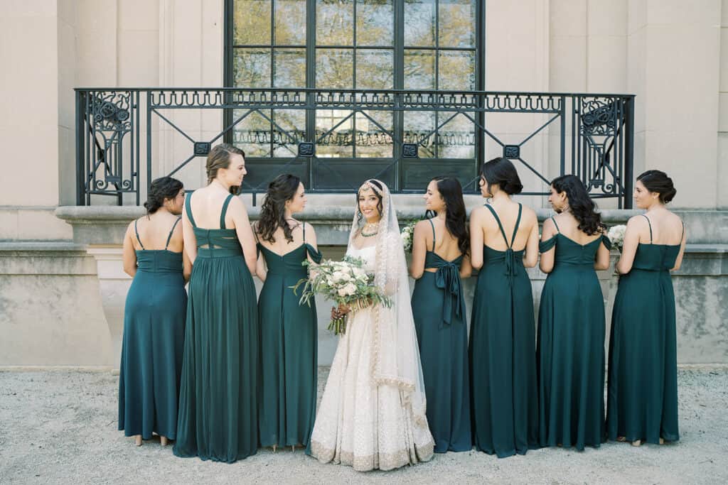 Bride and bridesmaids outside Rodin Museum wedding