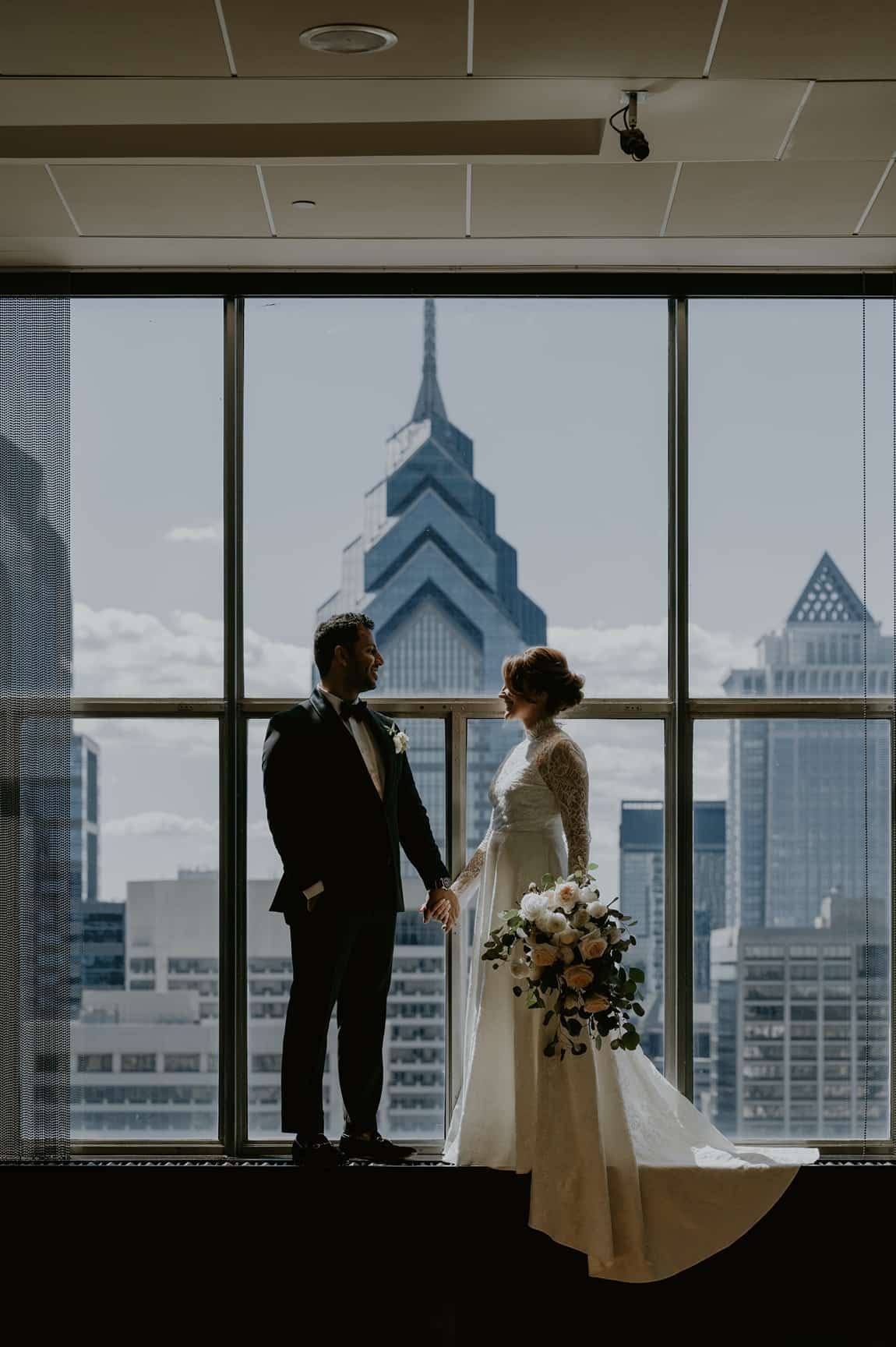 Bride and groom have first look in front of Philadelphia skyline