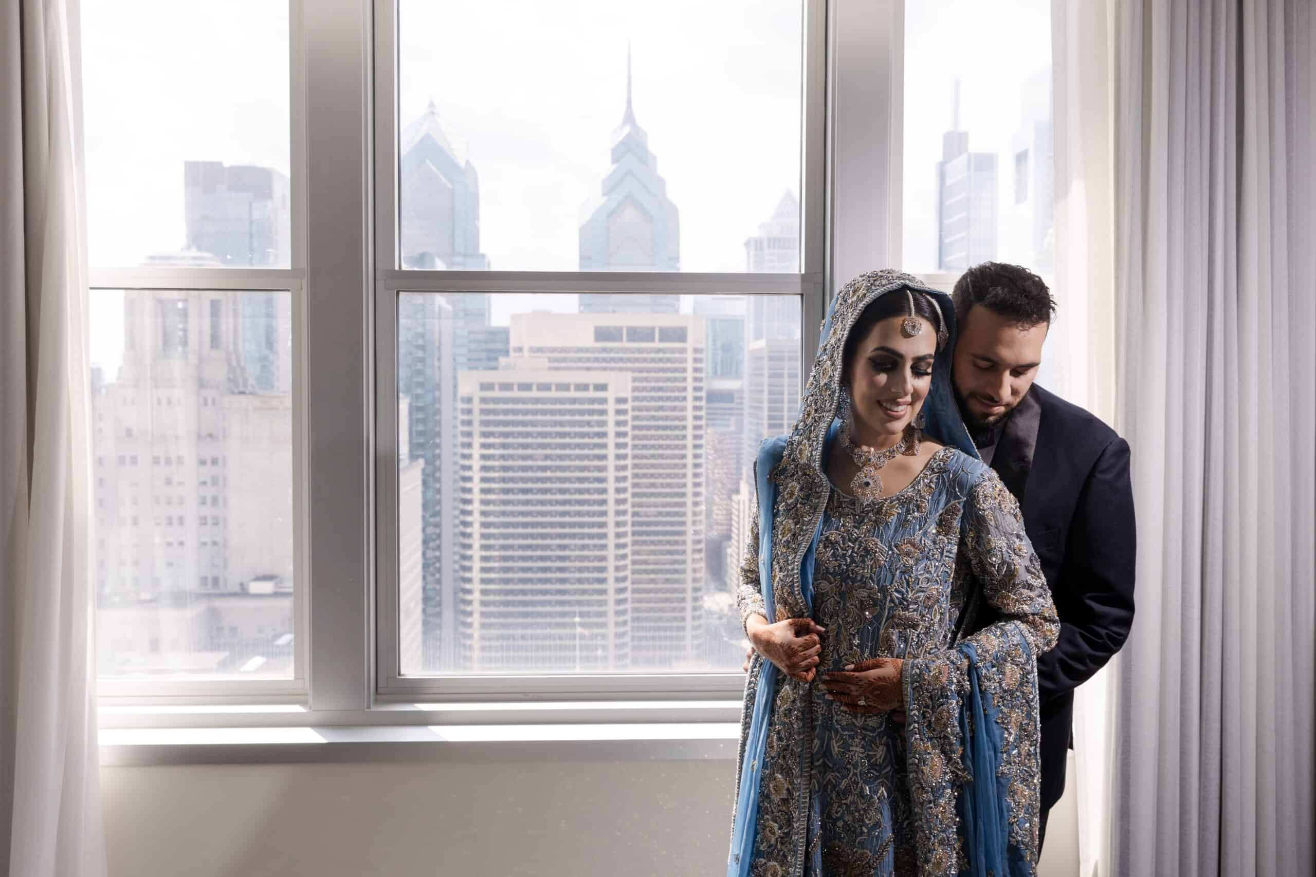 Bride and groom pose for portraits at loews philadelphia wedding