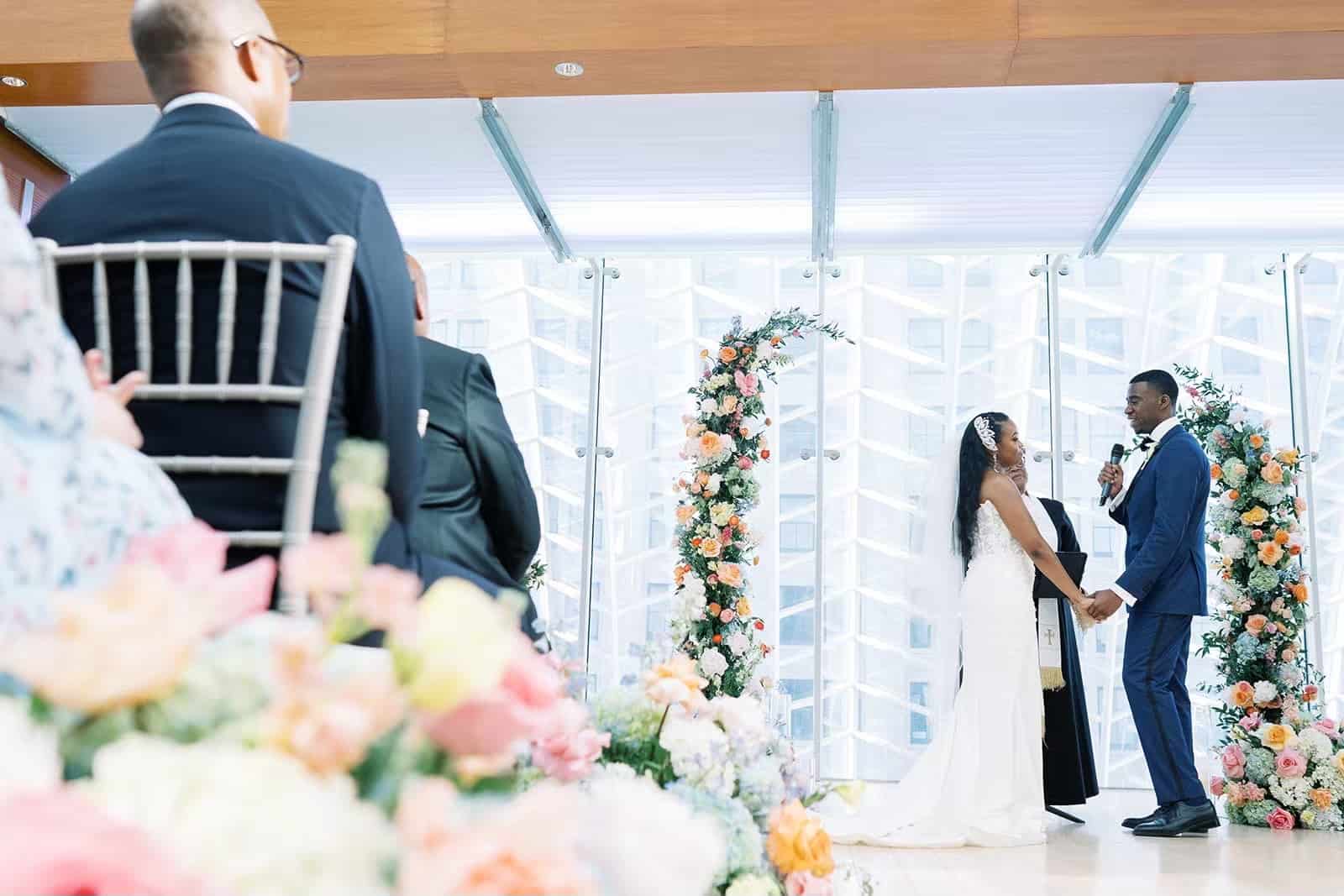 Bride and groom say wedding vows at their Kimmel Center wedding